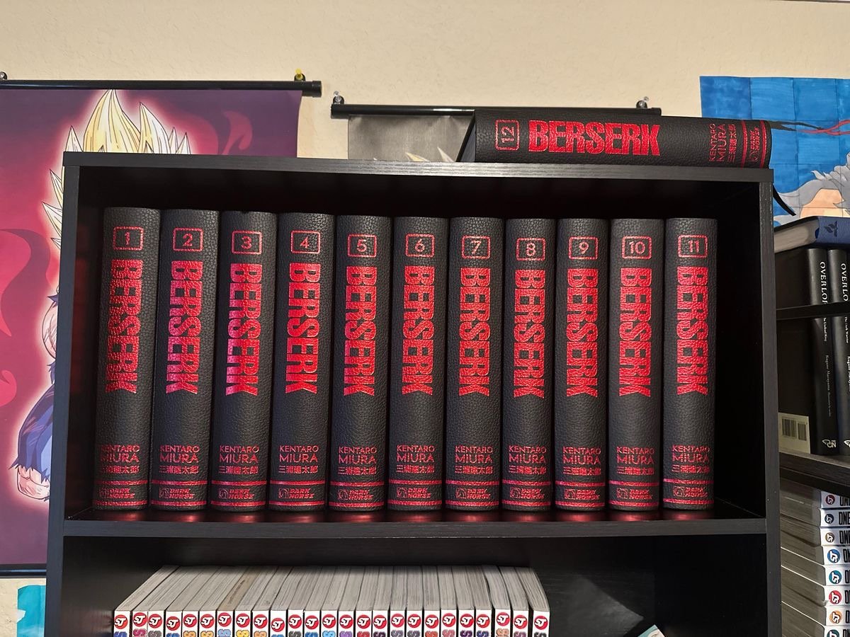 A shelf of Berserk Deluxe Edition volumes from Dark Horse